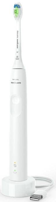 Une brosse à dents électrique blanche sur une base de chargement avec un câble USB.