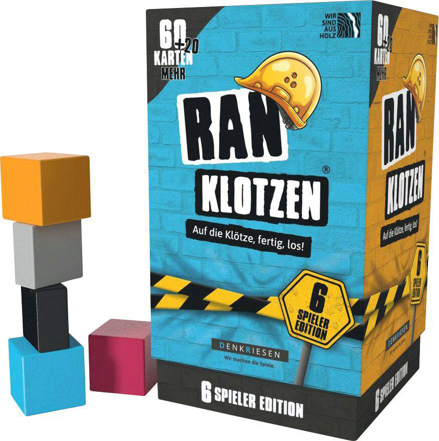 Kiste mit dem Spiel 'RAN KLOTZEN'. Es hat bunte Blöcke und eine Kiste mit Spieldetails.