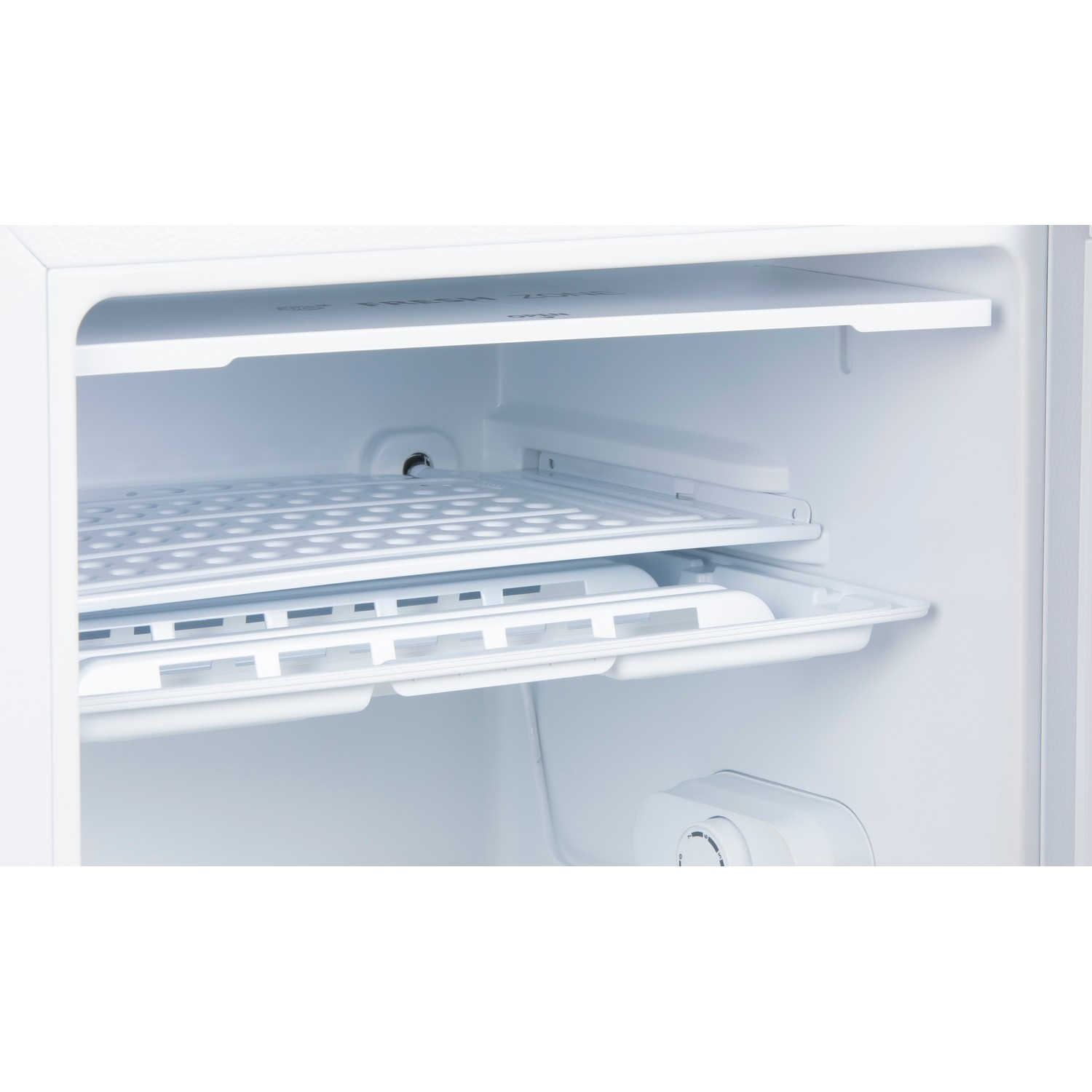 White interior of a refrigerator. Two shelves, a white tray, and a temperature control.