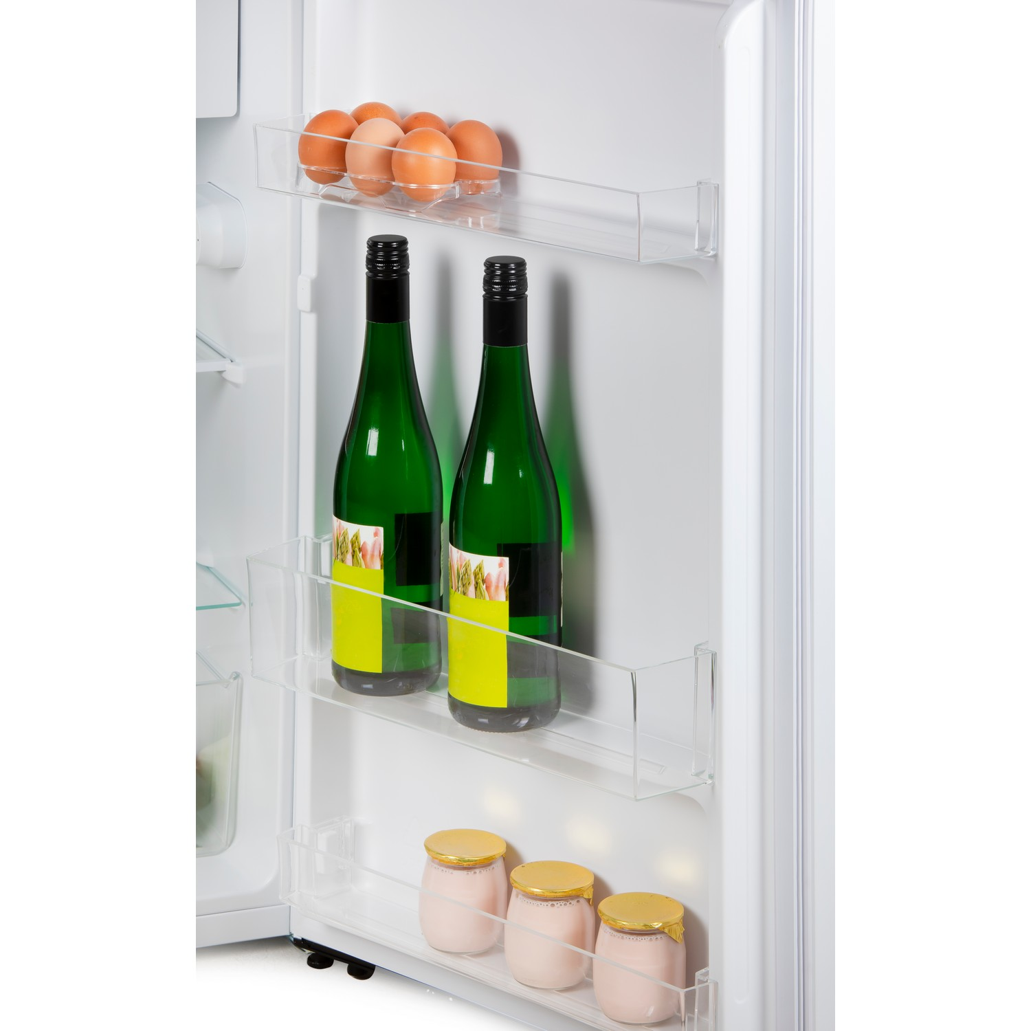 Refrigerator interior: eggs, wine bottles, yogurt.