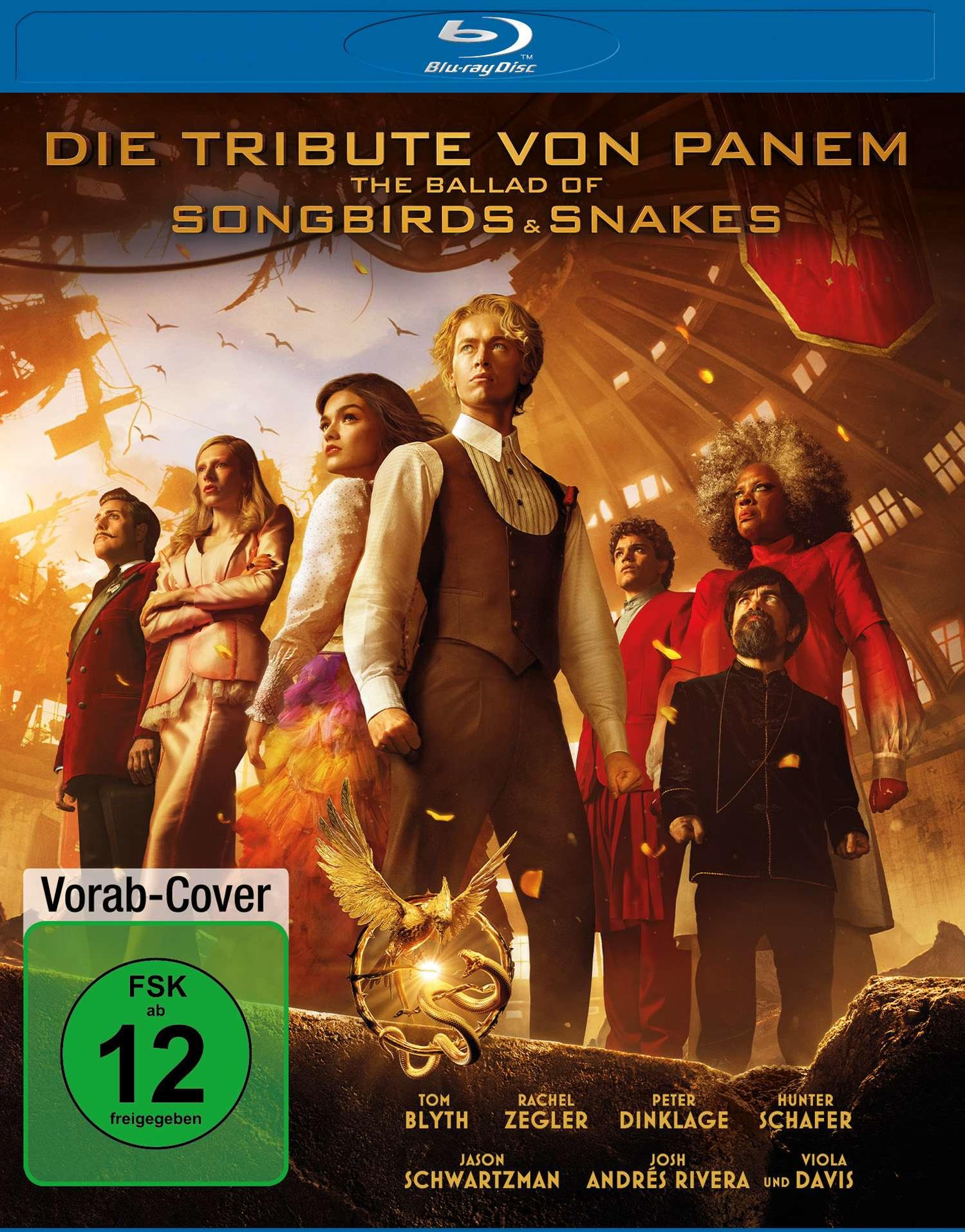Filmcover: Das Hunger Games Prequel. Personen stehen in zerstörter Stadt, Blu-ray Logo.