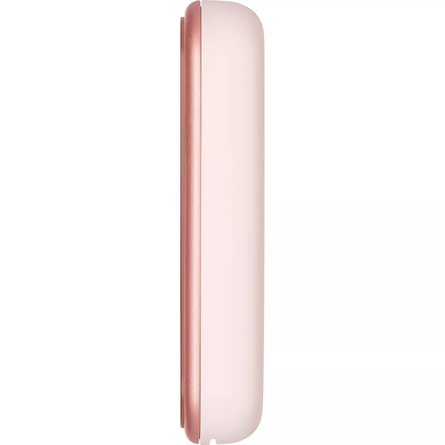 Seitenansicht eines rosa-weißen Geräts mit glänzender Oberfläche. Abgerundete Kanten und glatte Oberfläche.