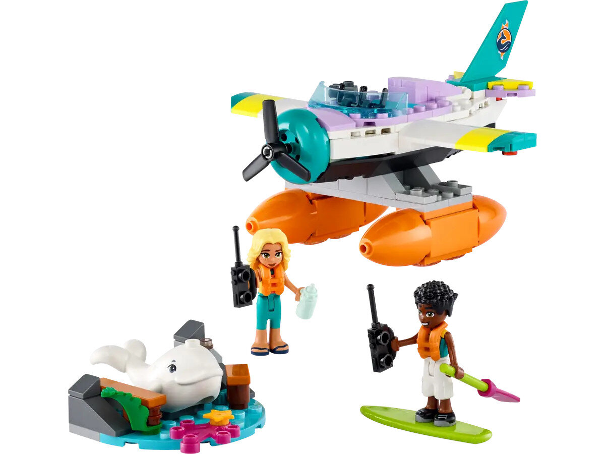 Zestaw Lego Friends z samolotem, dwiema figurkami, małą wyspą z wielorybem i surferem na desce.
