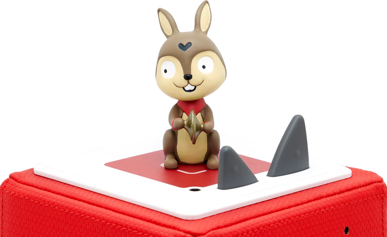 Figurine de lapin jouet sur une base rouge avec dessus blanc. Deux nageoires grises. Fond blanc.