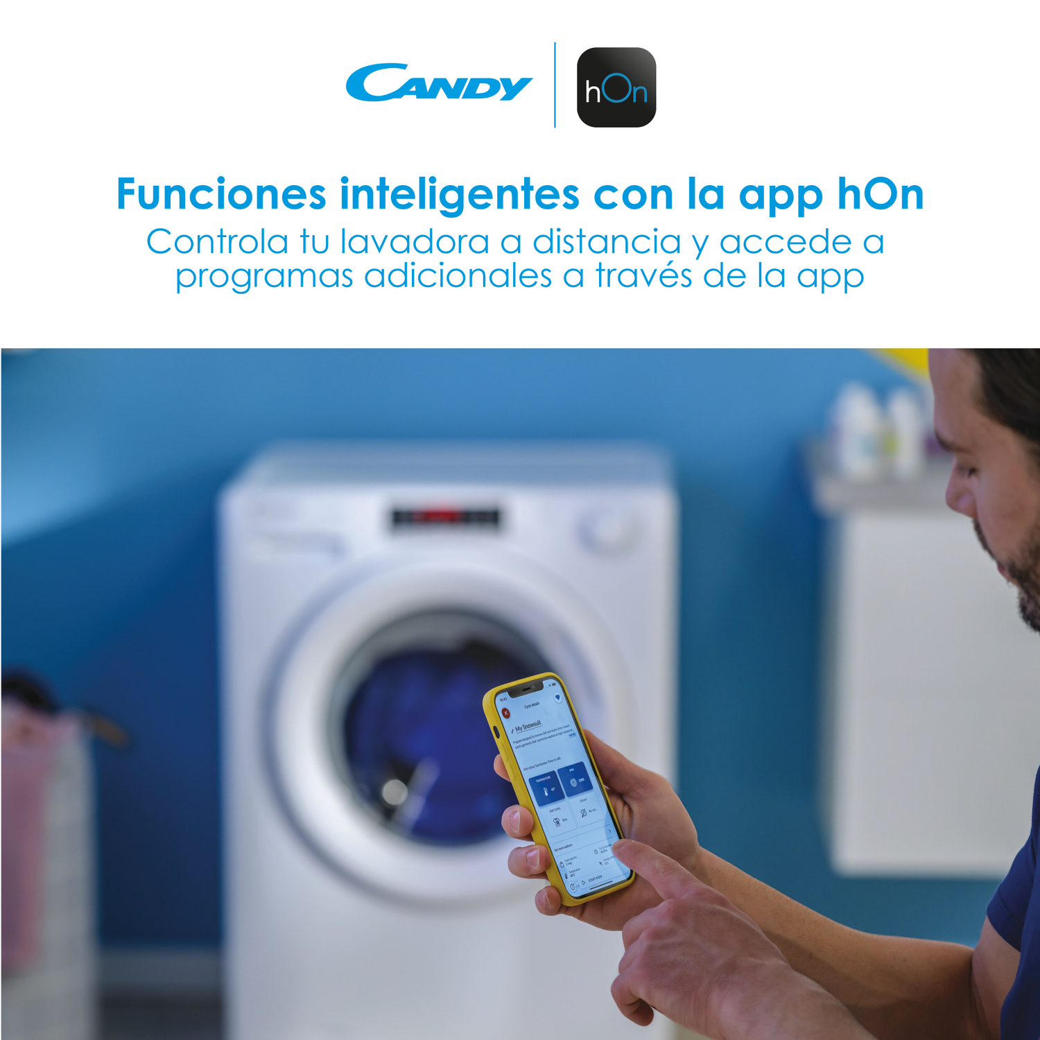 Hombre sosteniendo un teléfono amarillo, mostrando la app de control de lavadora. Lavadora blanca al fondo.