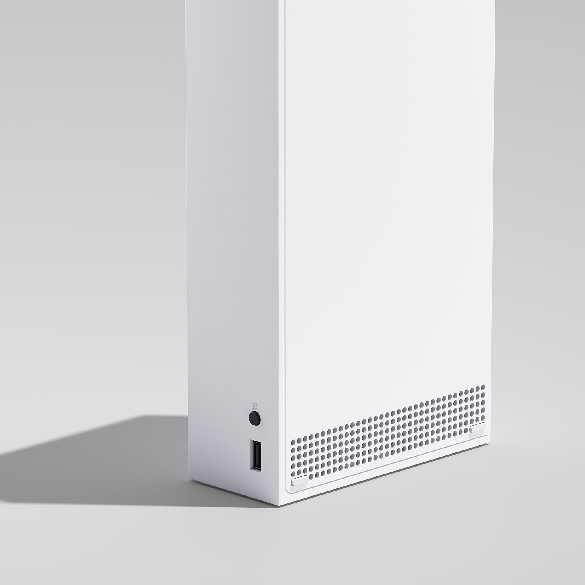 Hava delikleri ve bir güç düğmesi olan beyaz Xbox Series X.