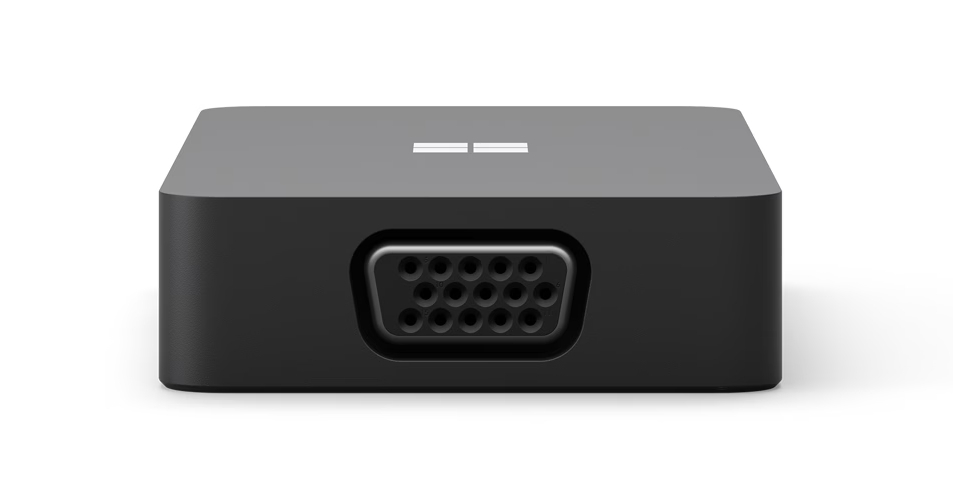 Schwarzer Microsoft-Adapter. Er hat einen VGA-Anschluss an der Vorderseite und das Microsoft-Logo oben.