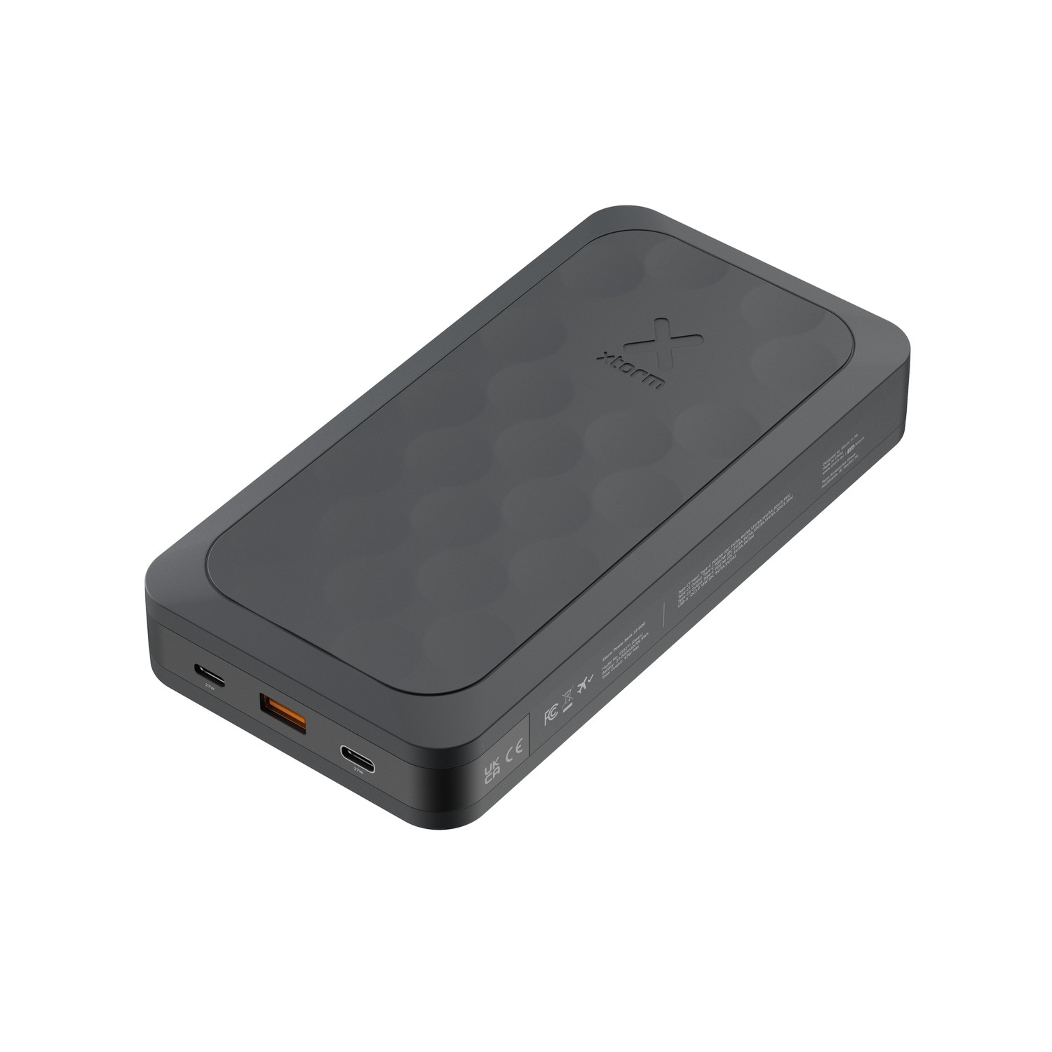 Black power bank, top view. Rectangular shape, with two ports and a wireless charging area.