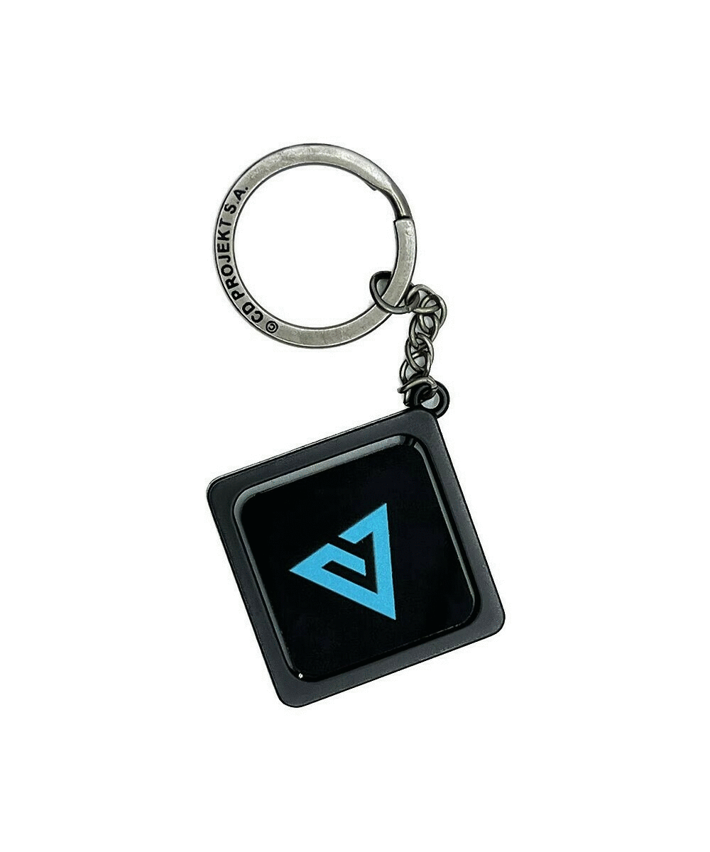 Brelok CD Projekt z czarnym i niebieskim logo na białym tle.