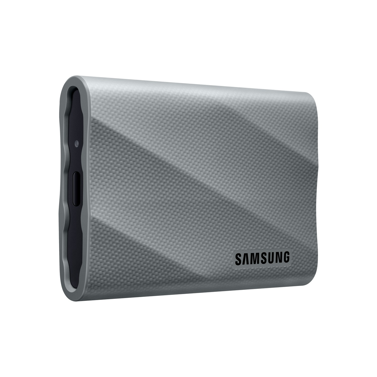 Grijze Samsung externe harde schijf, getextureerd oppervlak, zwarte kant met poort.