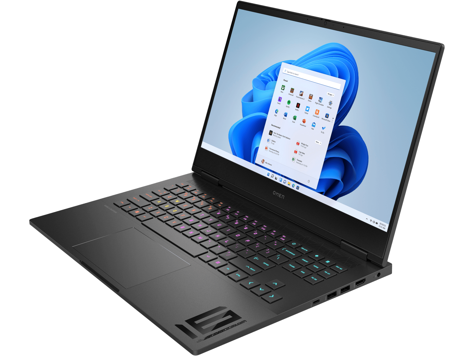 Un portátil negro con teclado colorido, abierto sobre una mesa. La pantalla muestra la interfaz de Windows 11.