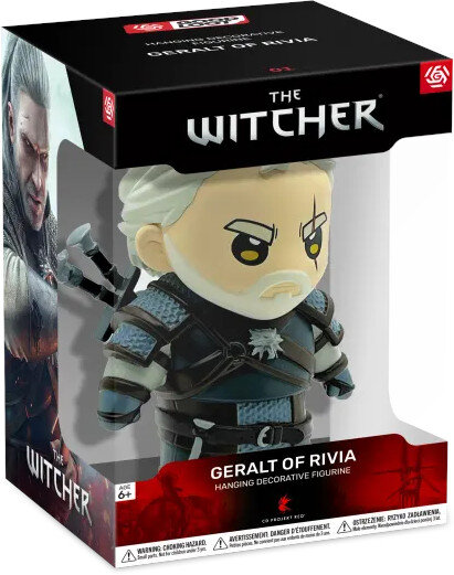Figurka Geralta z Rivii w pudełku. Figurka ma białą brodę, czarną zbroję i miecze.