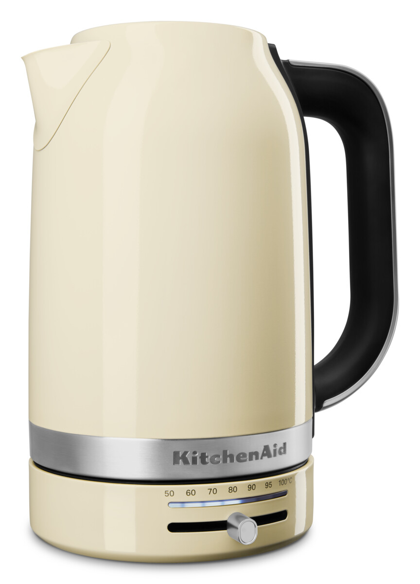 Cremefarbener Wasserkocher mit schwarzem Griff, silberner Basis und Temperaturregler.
