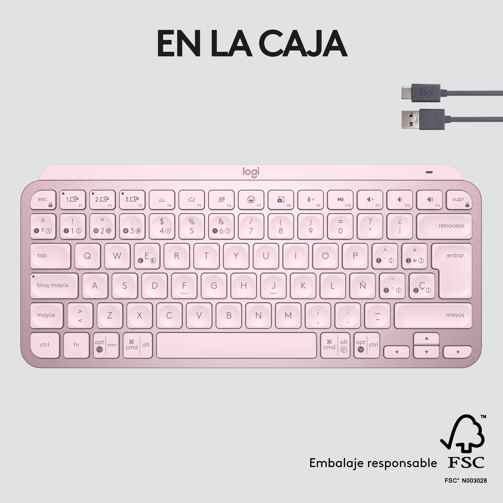 Teclado rosa con teclas blancas, dispuestas en un diseño estándar. Cables y texto son visibles.