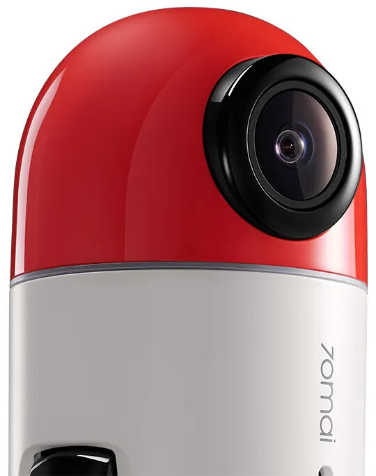 Czerwono-biała kamera z czarnym obiektywem.