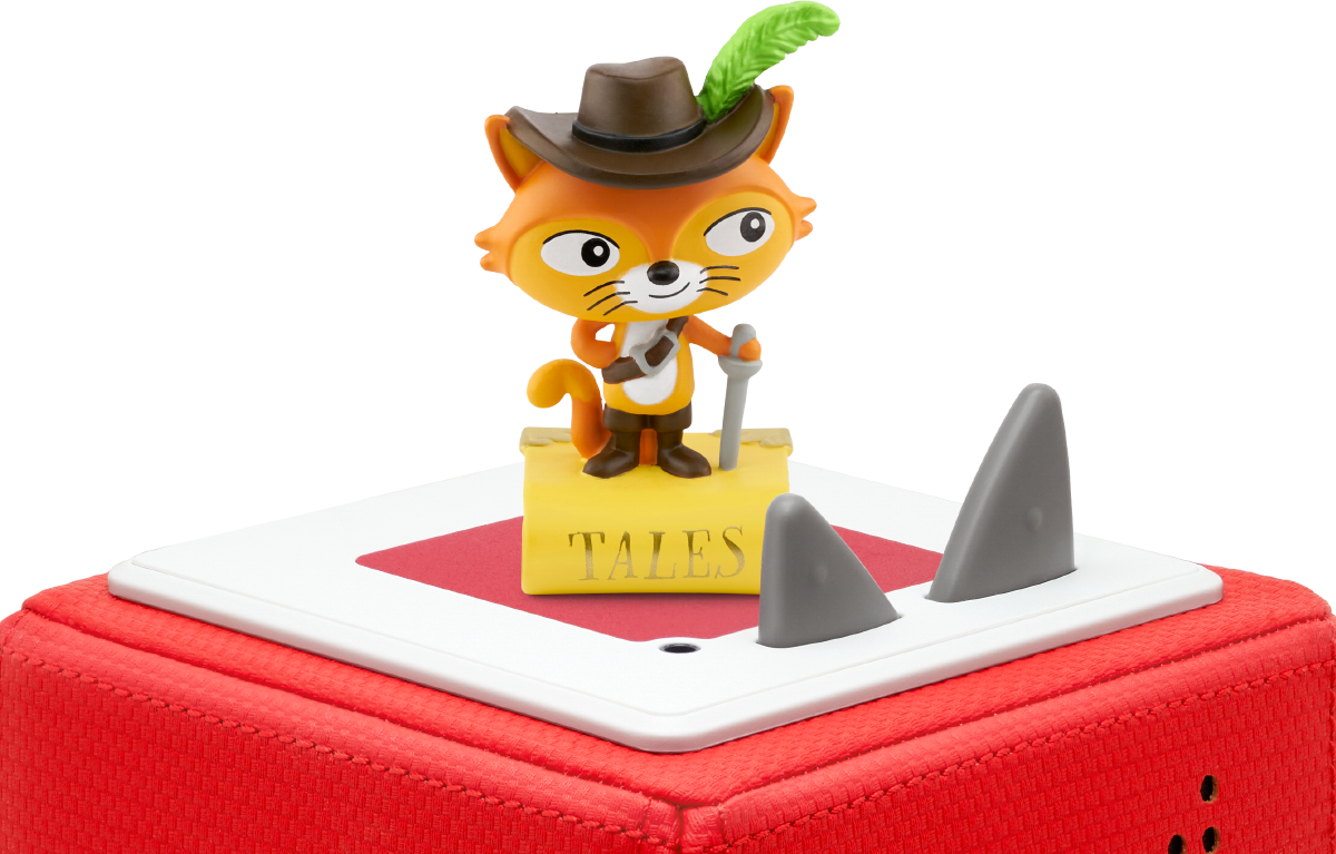 Un personnage de renard jouet avec un chapeau et une boîte rouge. Le jouet est sur une plateforme blanche.