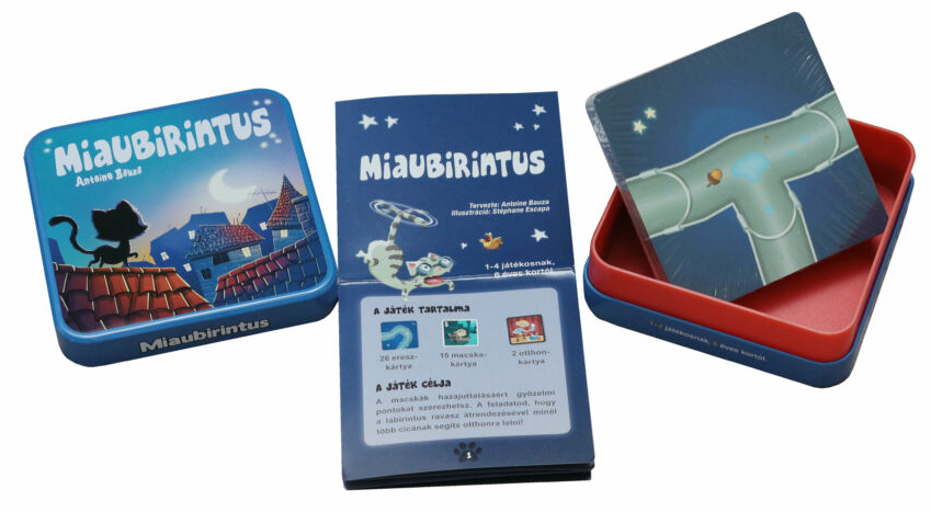 MiauBirintus játékkarton és nyitott doboz. A játék tartalma kártyákat és egy szabálykönyvet tartalmaz.