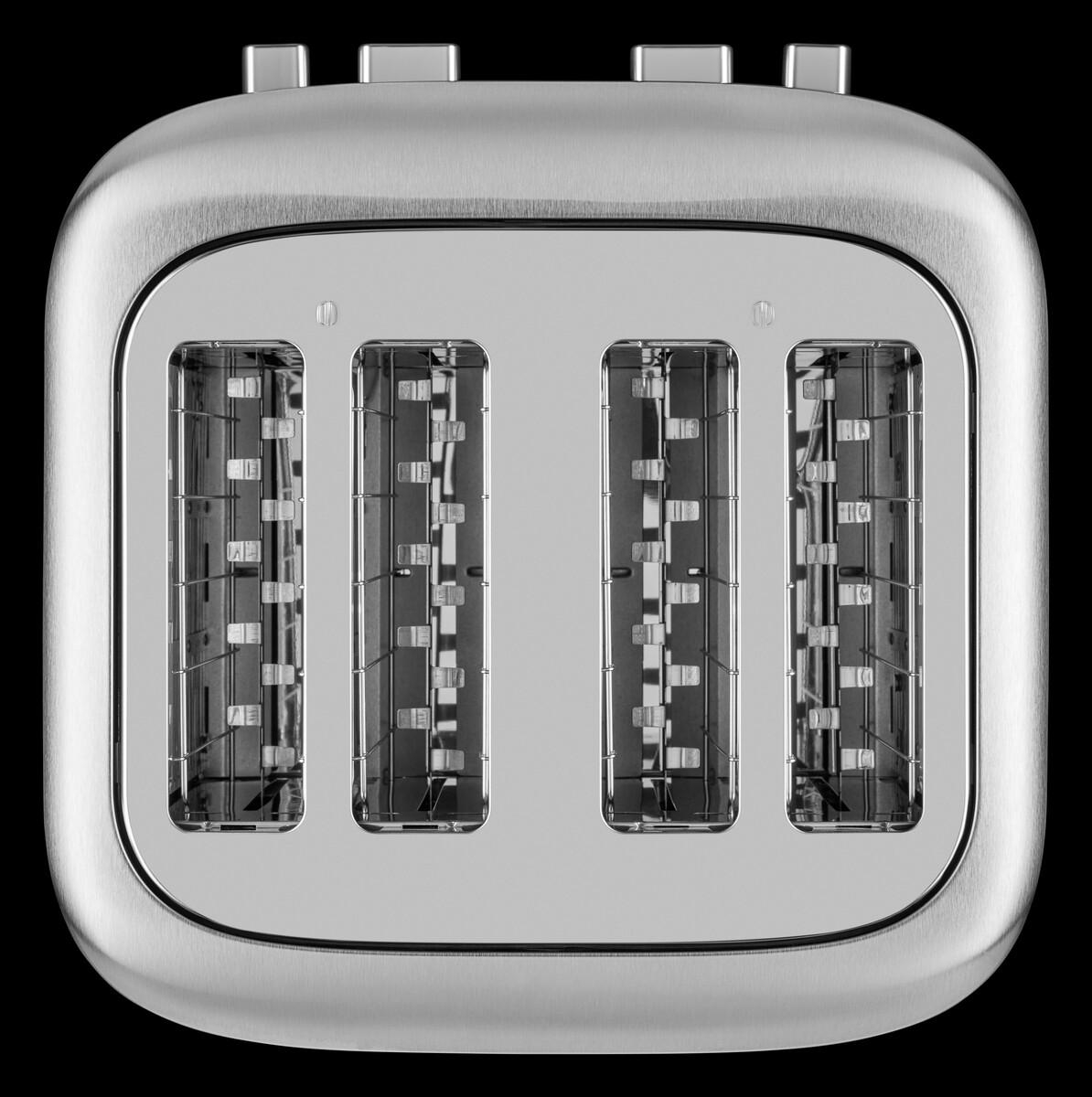 Draufsicht eines Edelstahl-Toasters mit vier Schlitzen auf schwarzem Untergrund.