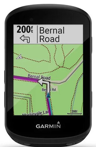 Czarne urządzenie Garmin wyświetla mapę z drogami. Ekran pokazuje 'Bernal Road' i strzałkę trasy. Urządzenie ma przyciski.