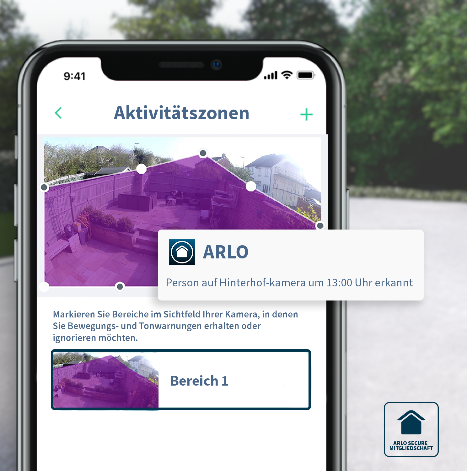Écran de téléphone montrant l'application Arlo, avec un contour de maison. Texte en allemand.