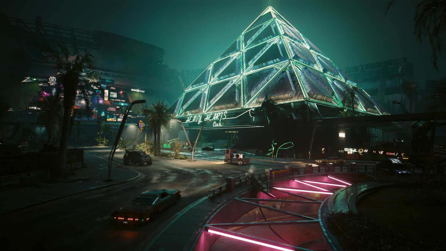 Paysage urbain futuriste de nuit, bâtiment en forme de pyramide et néons.