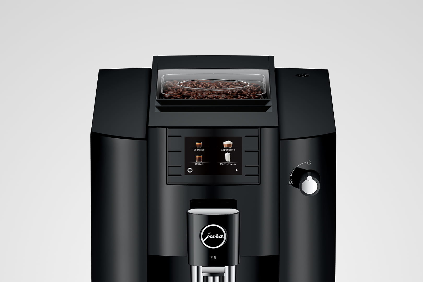 Cafetera negra con pantalla digital y contenedor de granos, fondo blanco.