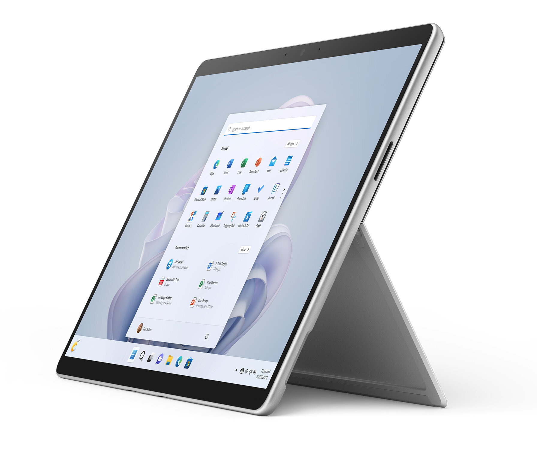 Srebrzysty tablet na stojaku, pokazujący biały ekran z ikonami aplikacji.