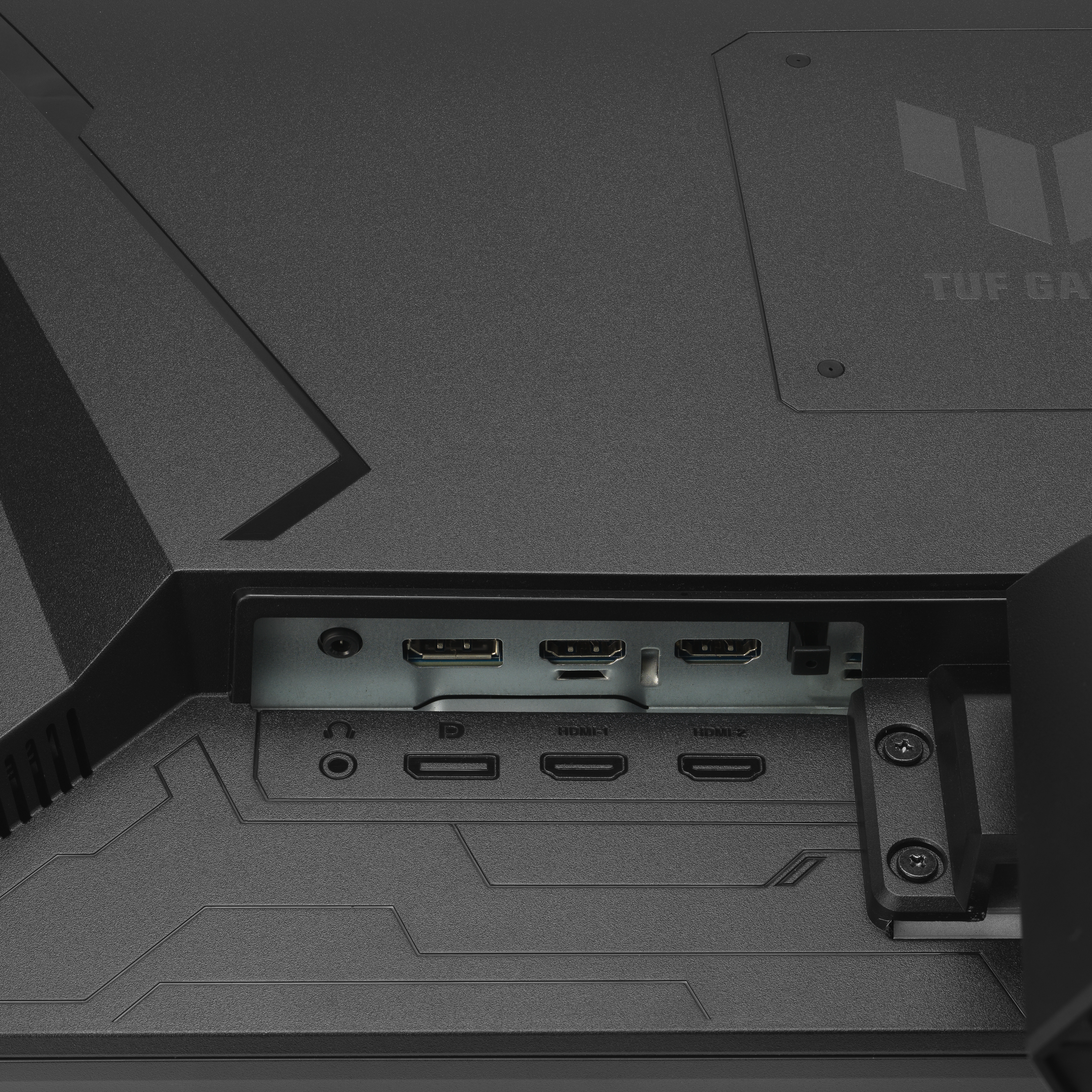 Gros plan de l'arrière d'un moniteur noir avec ports de connexion.