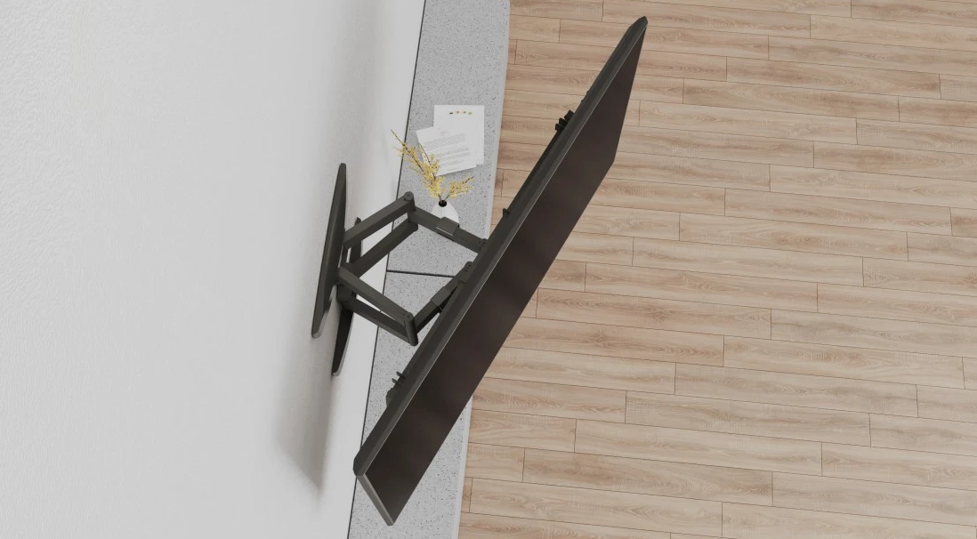 Fernseher an einer Wand mit Holzboden montiert. Der Fernseher ist geneigt.