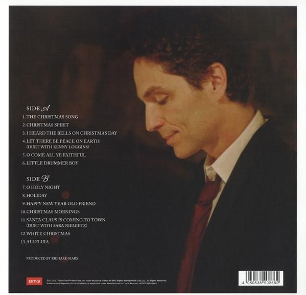 Albumcover mit Mann in Anzug und Krawatte, Titelliste sichtbar, weißer Hintergrund.