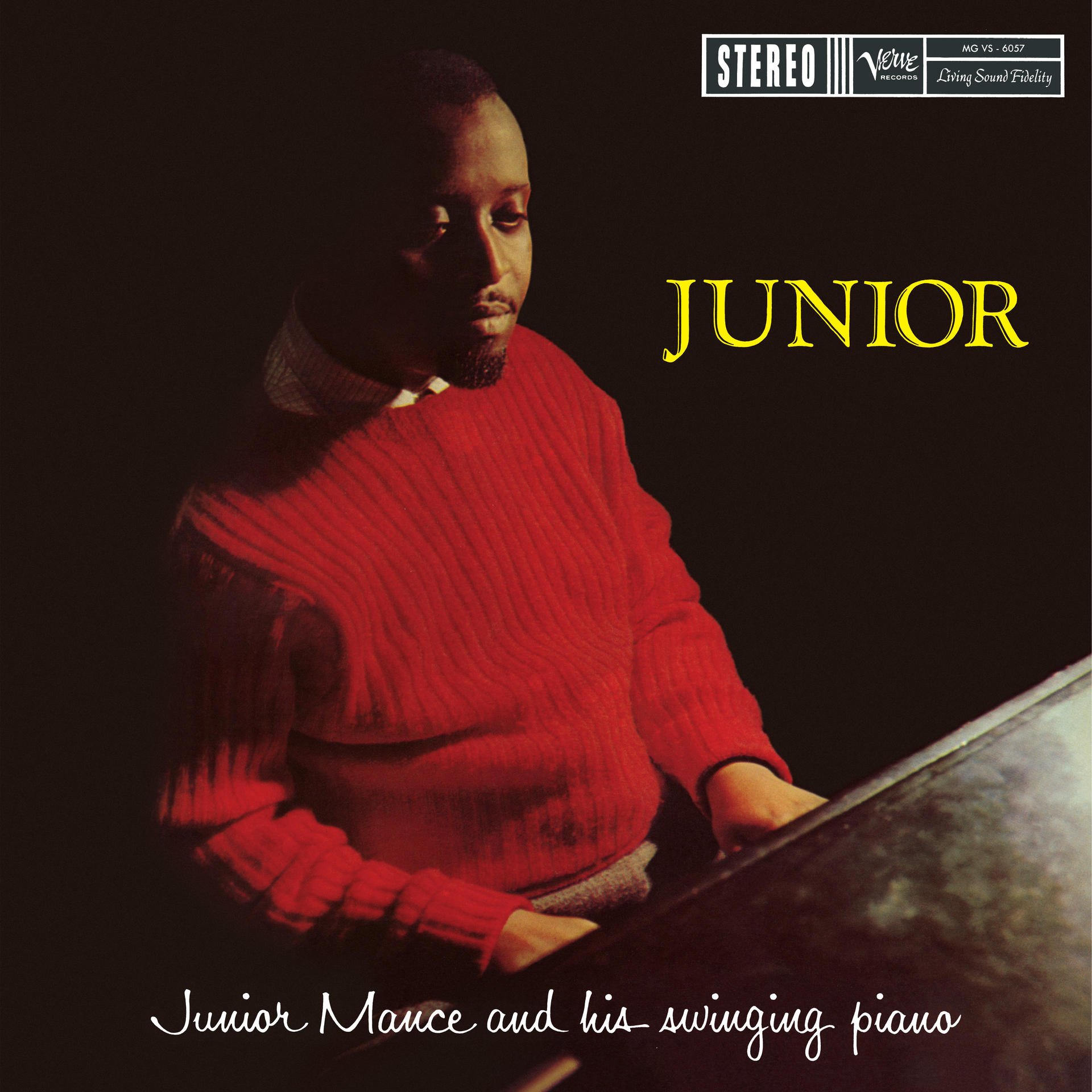 Albumcover mit einem Mann in rotem Pullover, der Klavier spielt.
