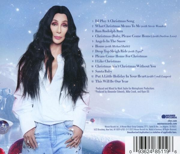 Cher-Albumcover. Cher, lange schwarze Haare, weißes Hemd, blaue Jeans. Weihnachtsalbum.