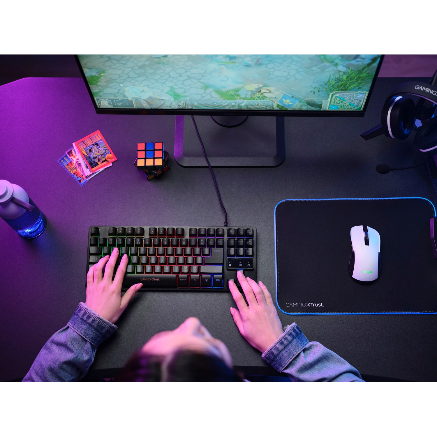 Overhead view of keyboard, mouse, and monitor on a desk.