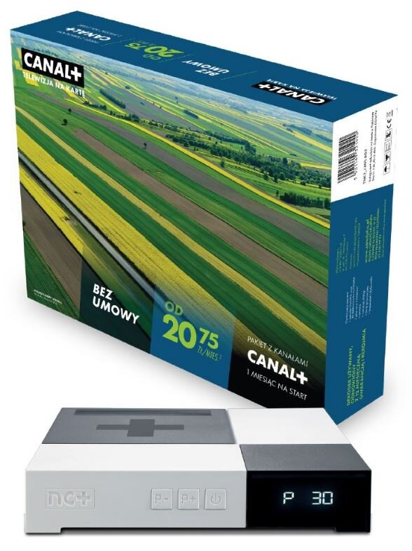 Dekoder i pakiet Canal+ TV. Pudełko ma krajobraz z polami i niebem.