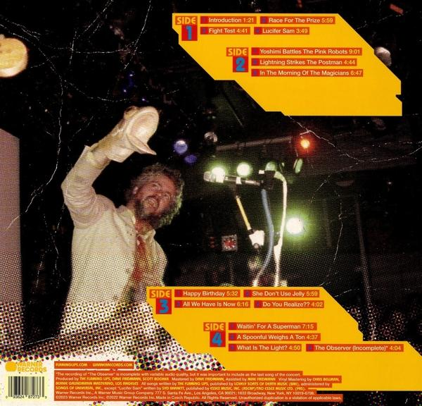Album-Rückseite mit Mann auf der Bühne, Songtiteln und Credits. Gelbes und schwarzes Design.