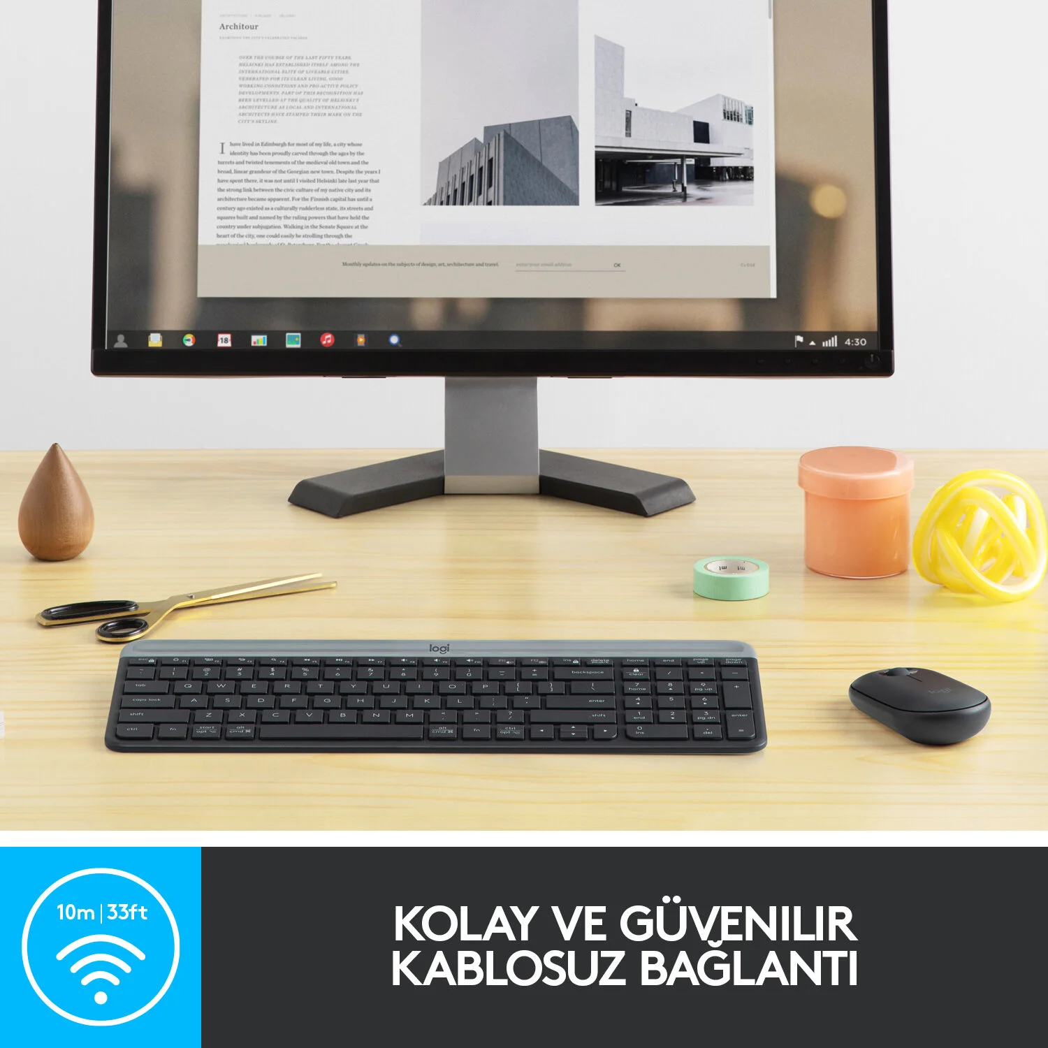 Klavye, fare ve web sayfası bulunan monitör, masada eşyalar, kablosuz menzil bilgisi.