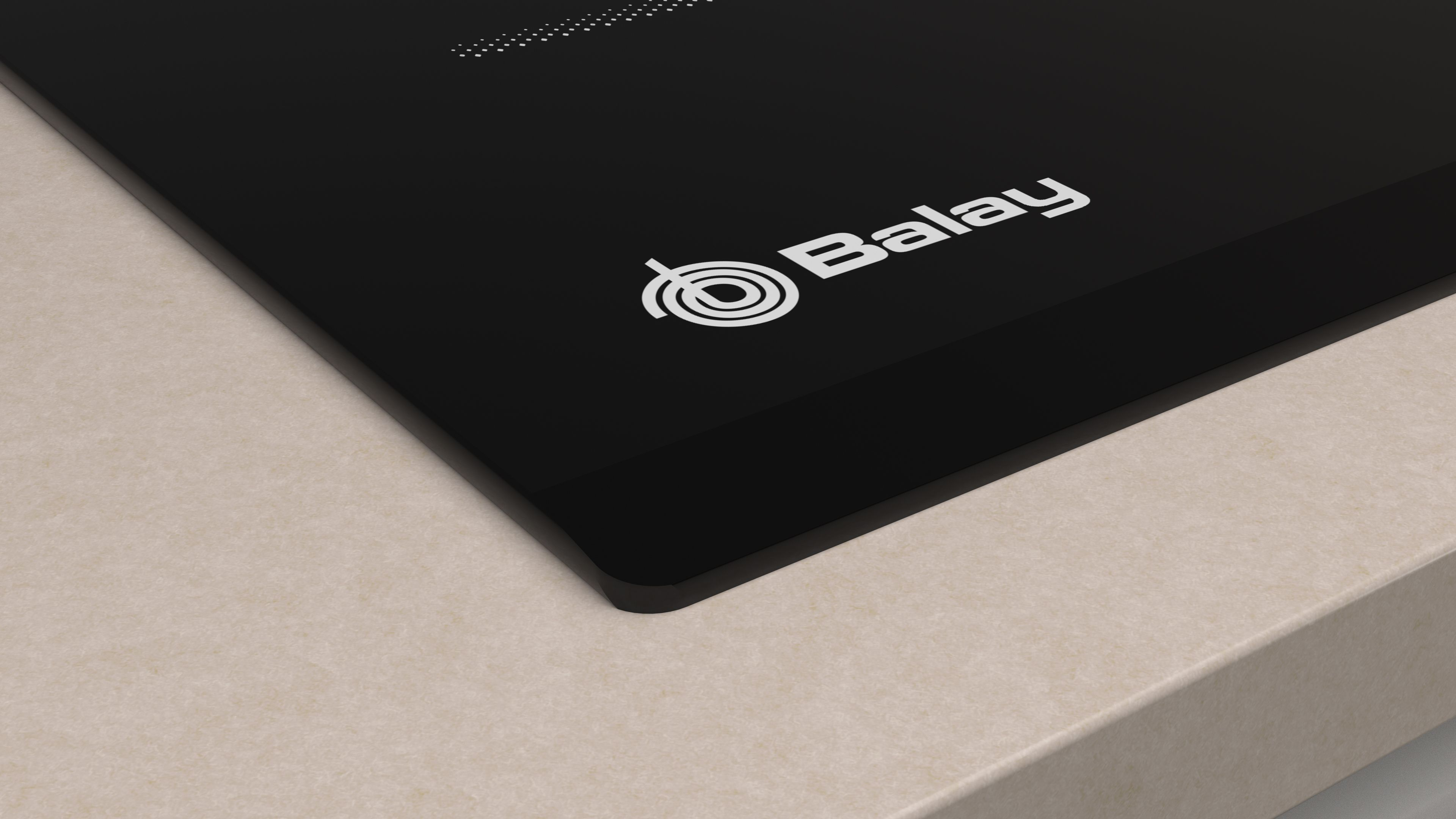 Primer plano de una placa de inducción negra con el logotipo de Balay y una encimera beige.