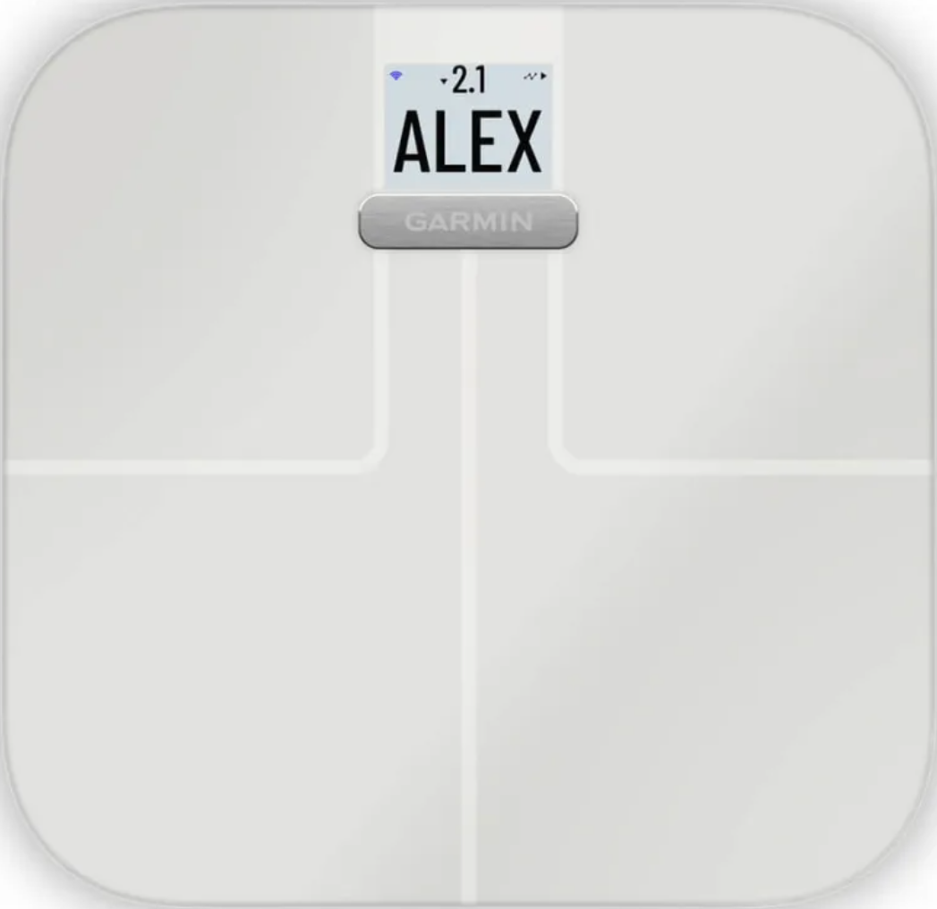 Bilancia Garmin bianca con il nome ALEX visualizzato sullo schermo.