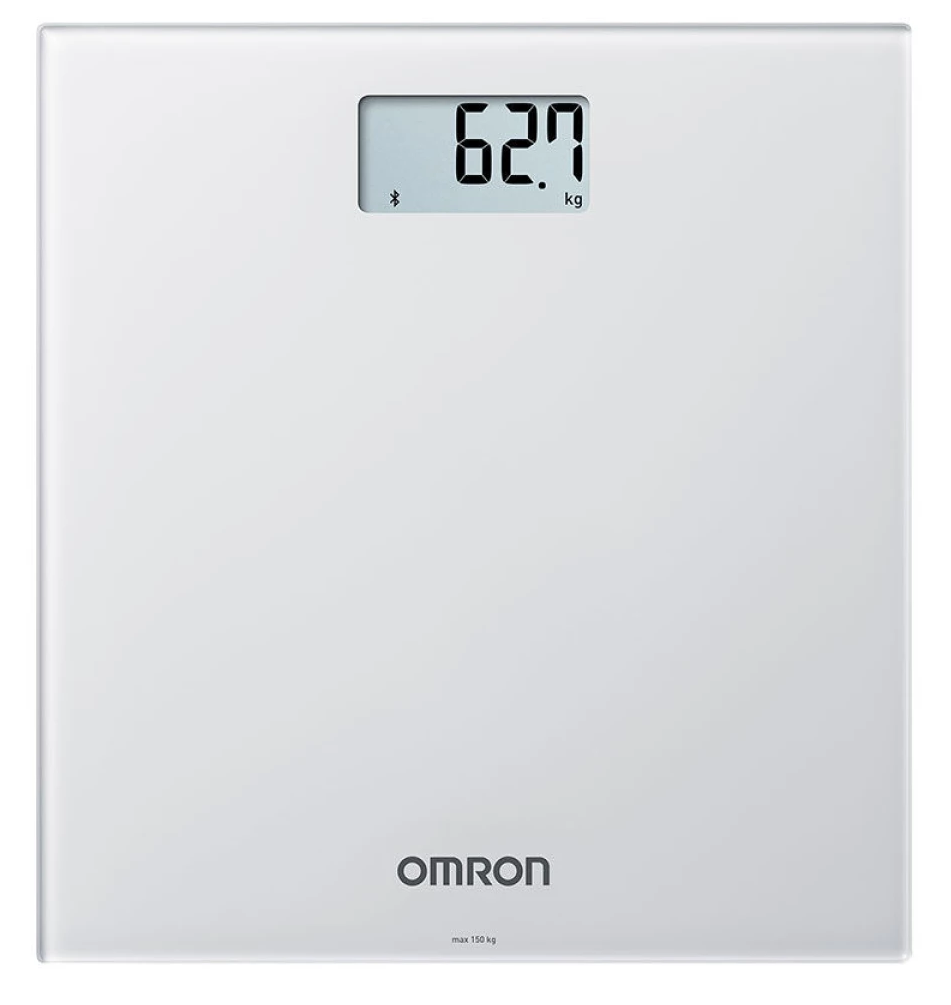 Fehér digitális mérleg, 62,7 kg-ot mutat. Márka: OMRON.