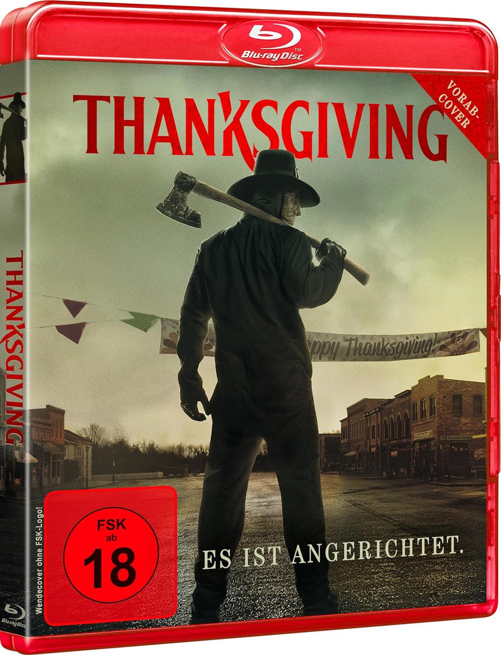 Filmcover von 'Thanksgiving'. Ein Mann in Schwarz, mit einer Axt, steht in einer Stadt, mit unscharfem Hintergrund.