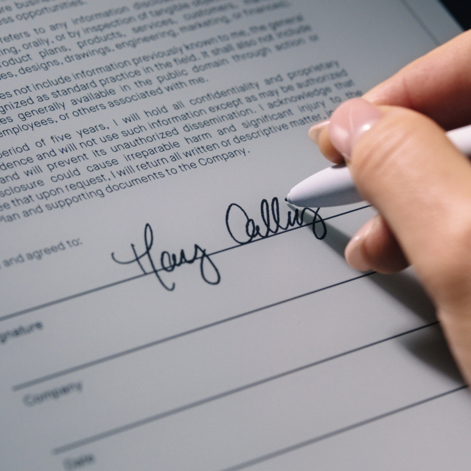 A hand writing on a document with a white pen, signing the signature line.  Signature is visible.