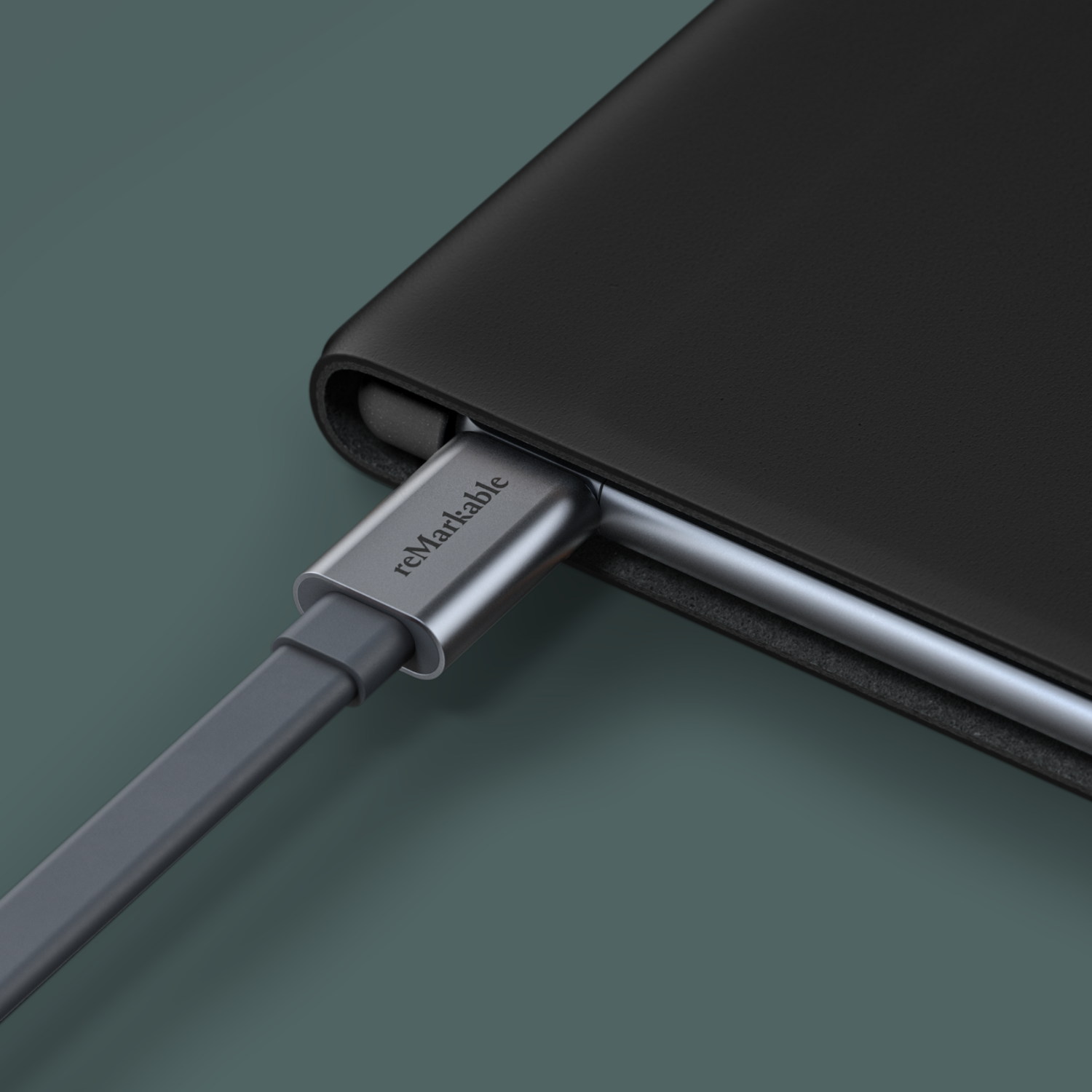 Remarkable tablet connected with a gray USB-C cable.