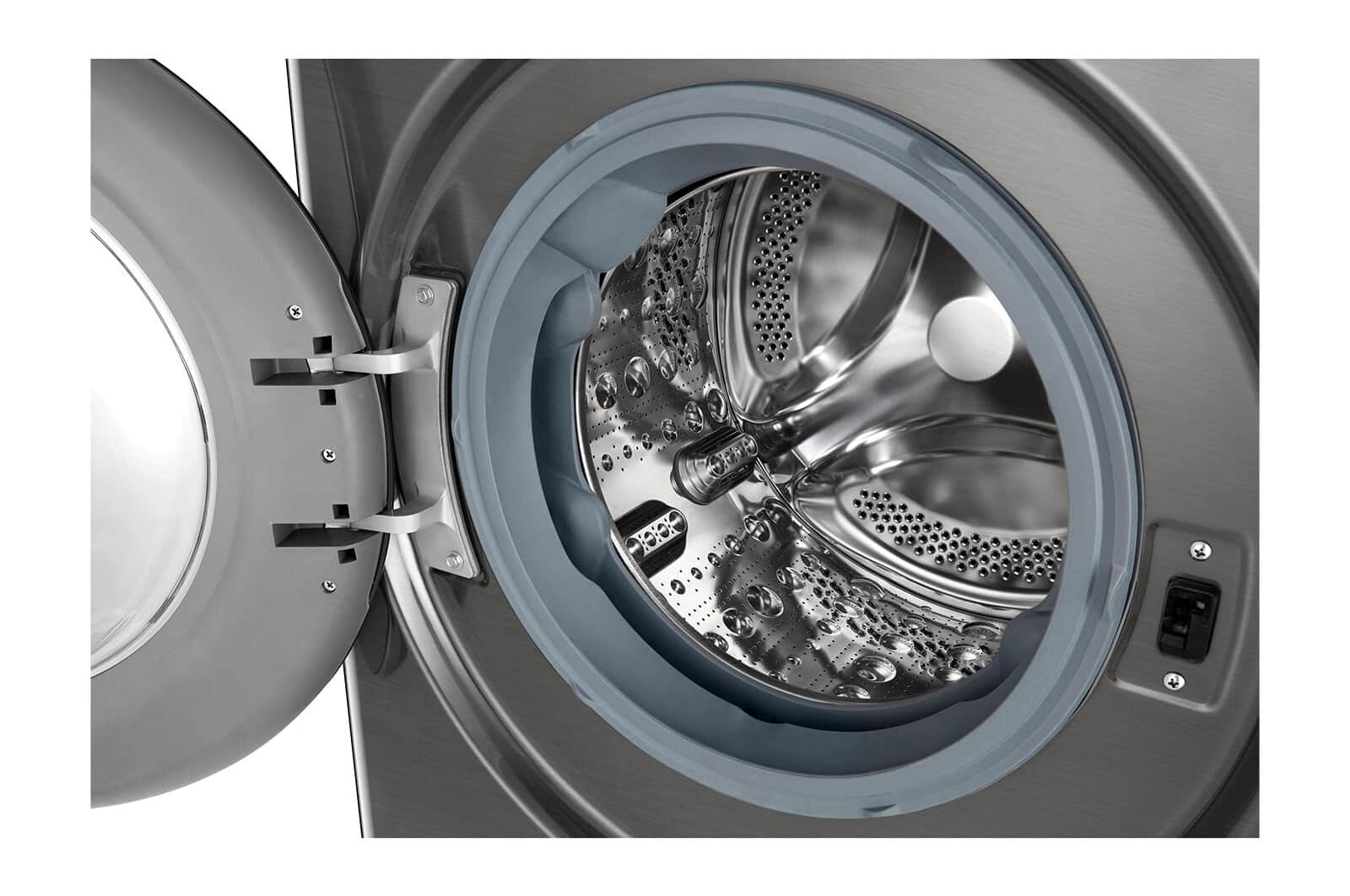 Bęben pralki, otwarte drzwi, srebrny kolor. Widok wewnętrzny pokazuje perforacje i niebieską uszczelkę gumową.