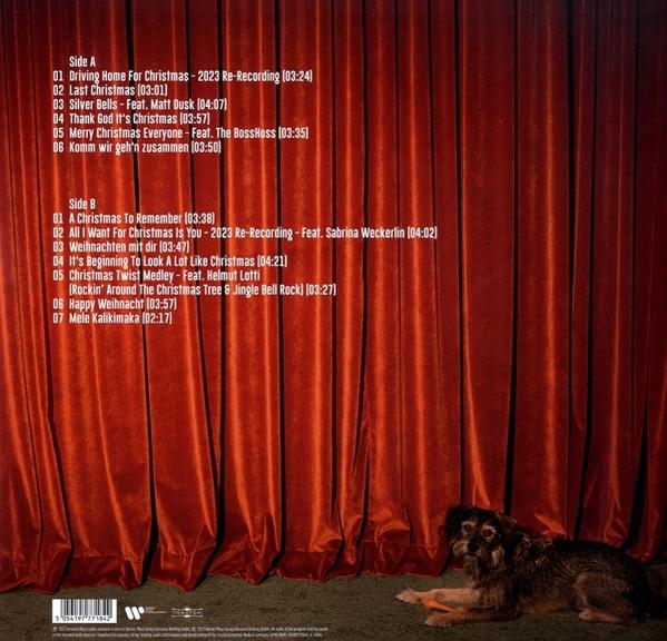 Eine Vinyl-Schallplatte mit Titeln und einem Hund vor einem roten Vorhang.