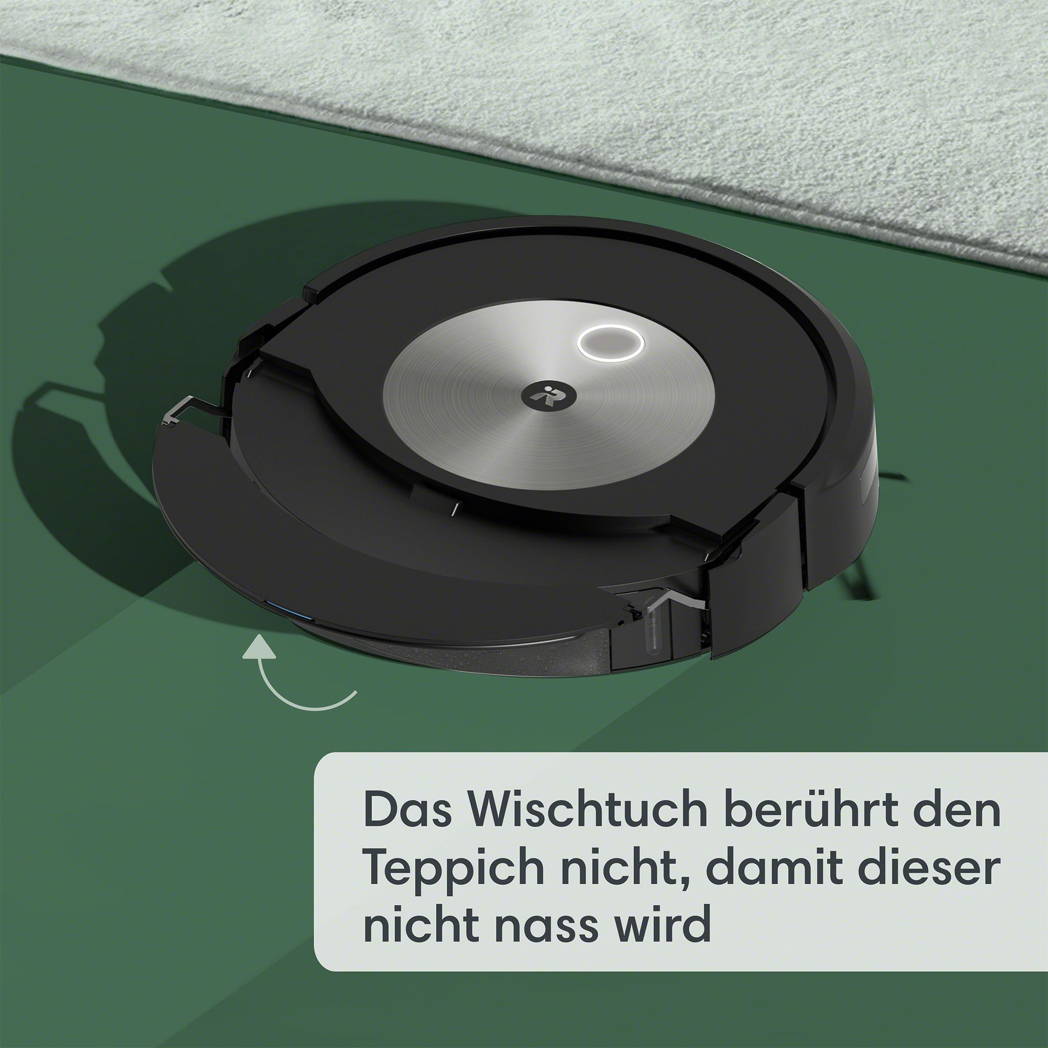 Ein schwarzer Roboter-Staubsauger auf einem grünen Teppich, mit Text, der besagt, dass er den Teppich nicht nass macht.