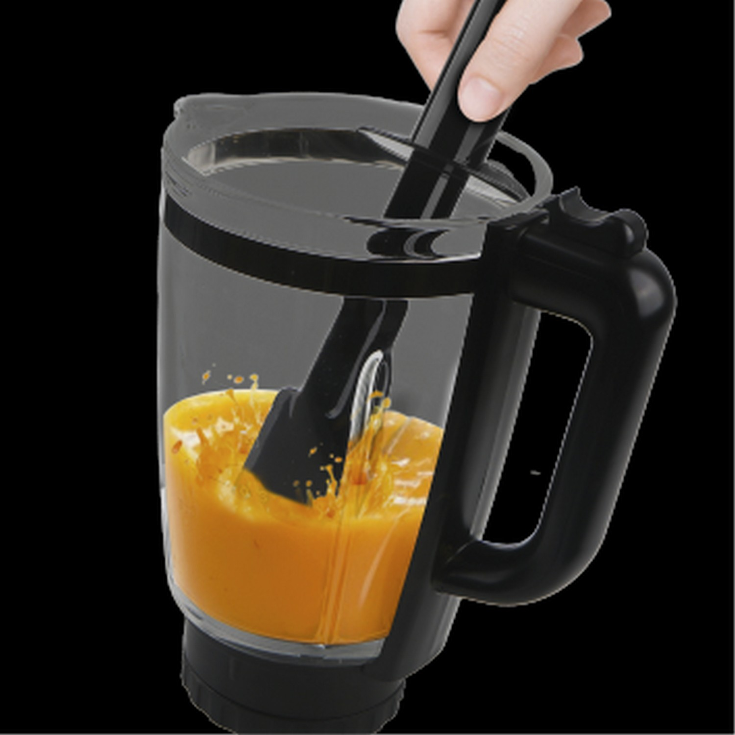 A blender with orange liquid being stirred by a black tool, on a black background.