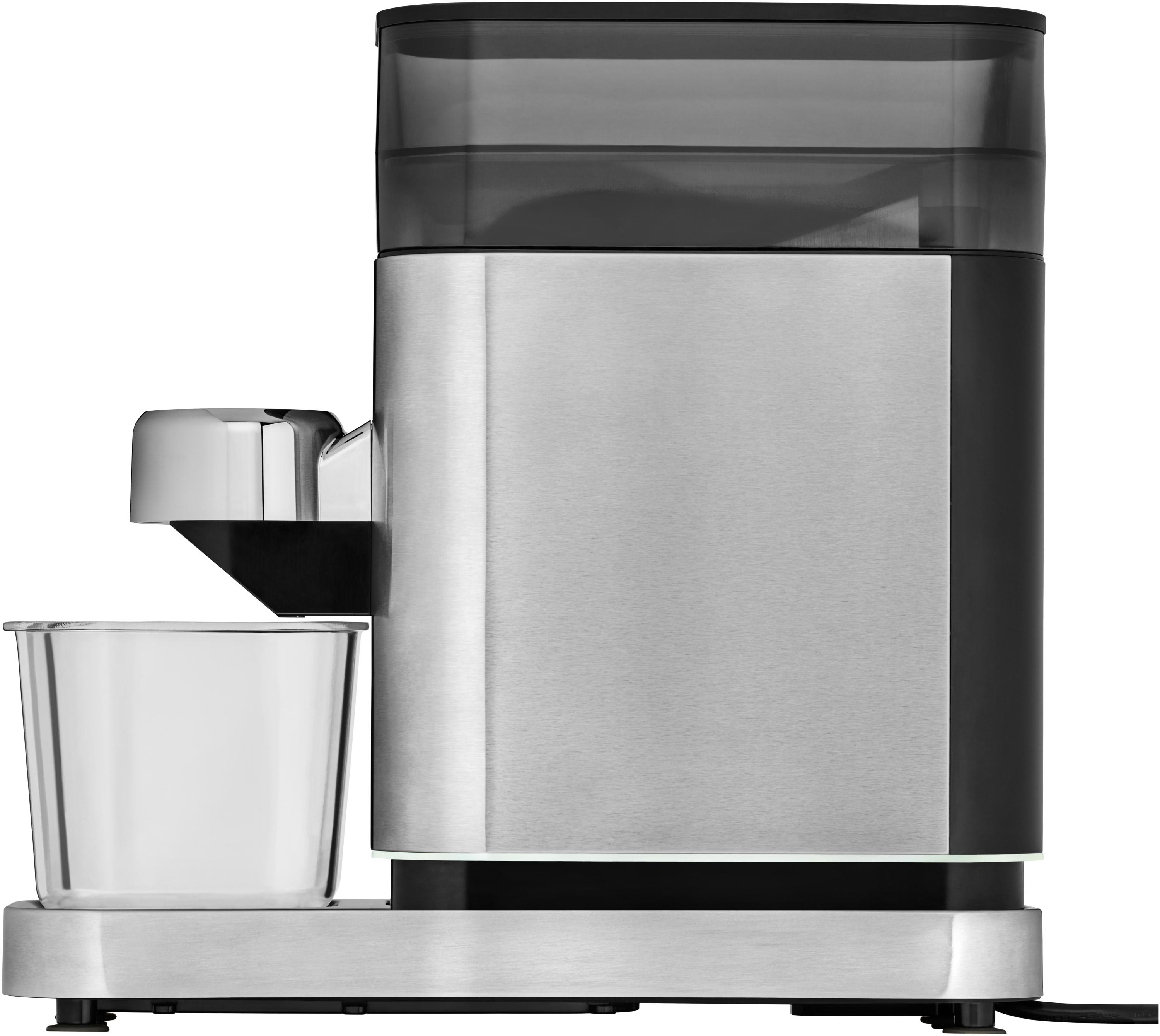 Kaffeemühle aus Edelstahl mit schwarzem Oberteil und einer durchsichtigen Tasse auf Metallbasis.