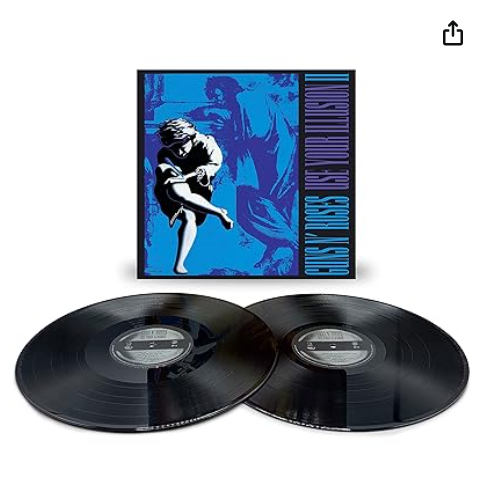 Albumcover: 'Guns N' Roses - Use Your Illusion II'. Zwei Vinylplatten unter blauem Bild.