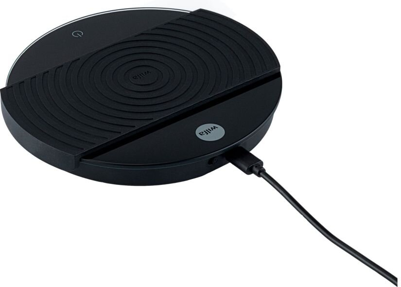 Czarna, okrągła bezprzewodowa podkładka ładująca z przewodem zasilającym.