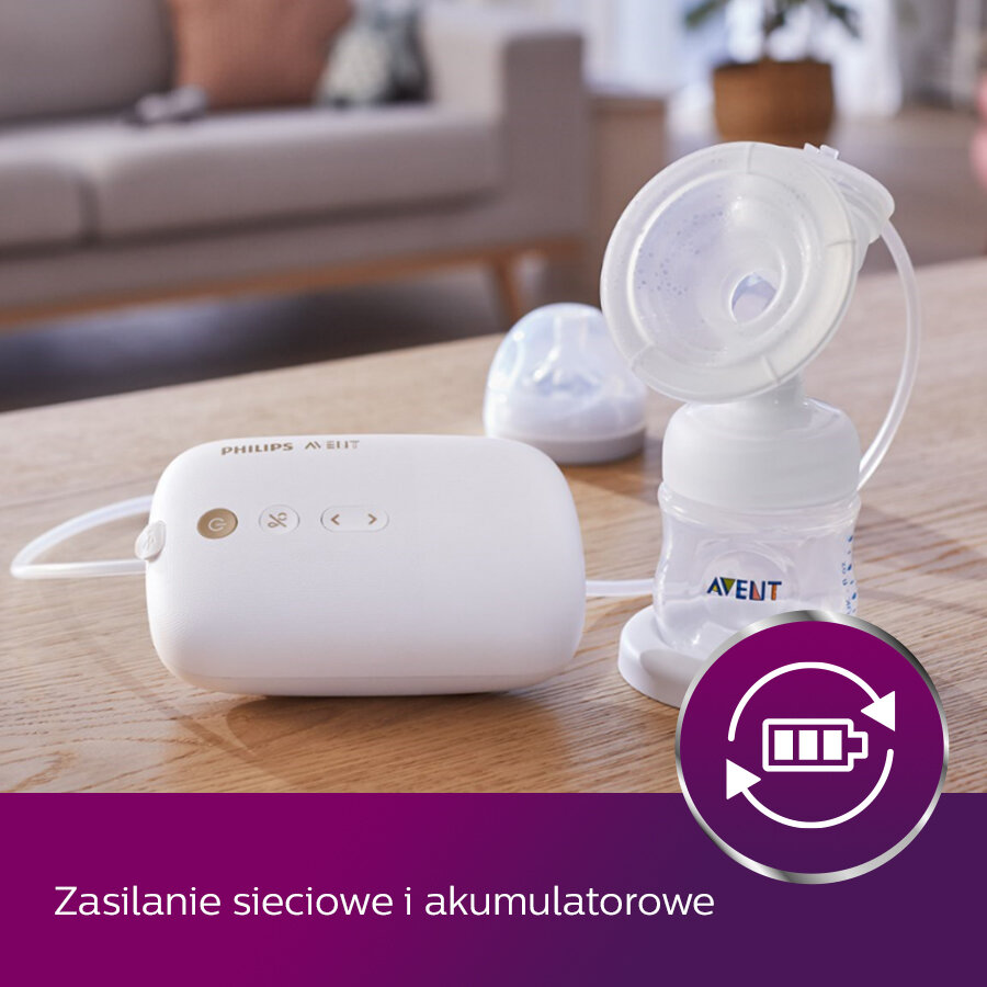 Biała laktator z butelką na drewnianym stole. Zasilanie sieciowe i bateryjne.